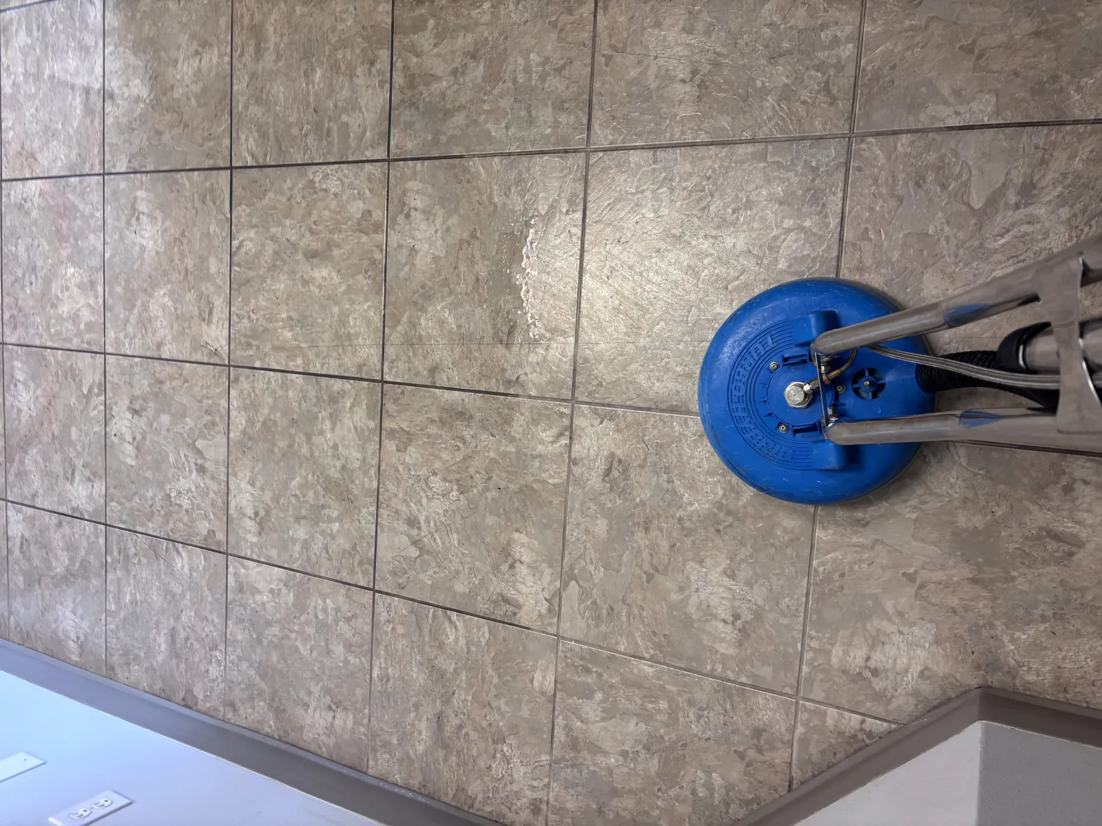 Stone sealing process on travertine floor in St. George